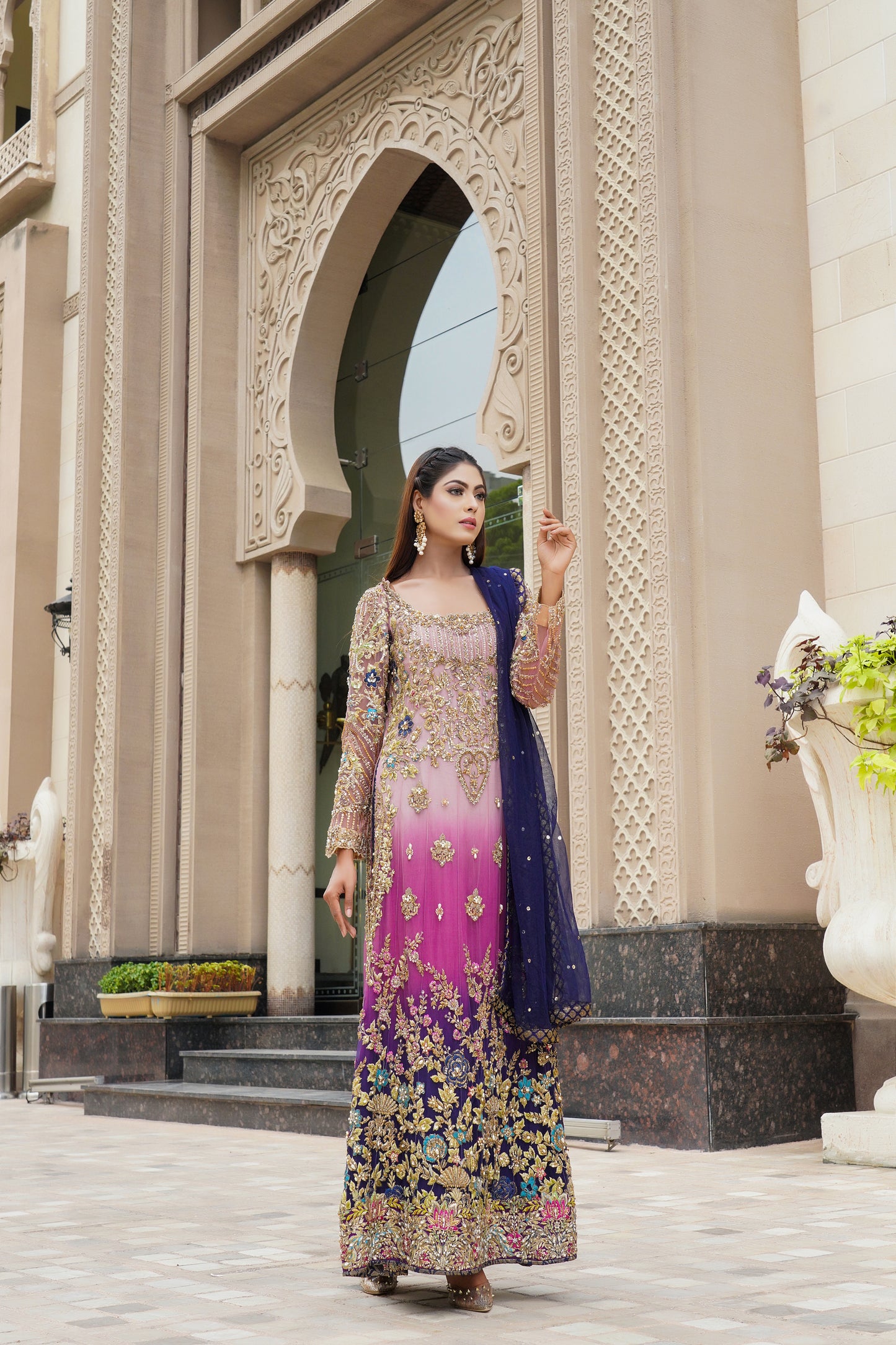 Purple and lacy lilac ombre Pakistani formal dress with dupatta: A stunning dress featuring a blend of purple and lacy lilac colors with intricate embroidery and beadwork on the bodice. The A-line silhouette is made with high-quality, comfortable fabric. The matching dupatta is sheer and lightweight