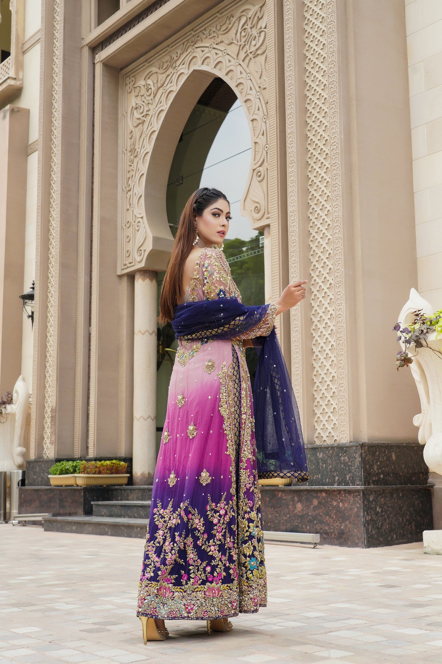 Purple and lacy lilac ombre Pakistani formal dress with dupatta: A stunning dress featuring a blend of purple and lacy lilac colors with intricate embroidery and beadwork on the bodice. The A-line silhouette is made with high-quality, comfortable fabric. The matching dupatta is sheer and lightweight