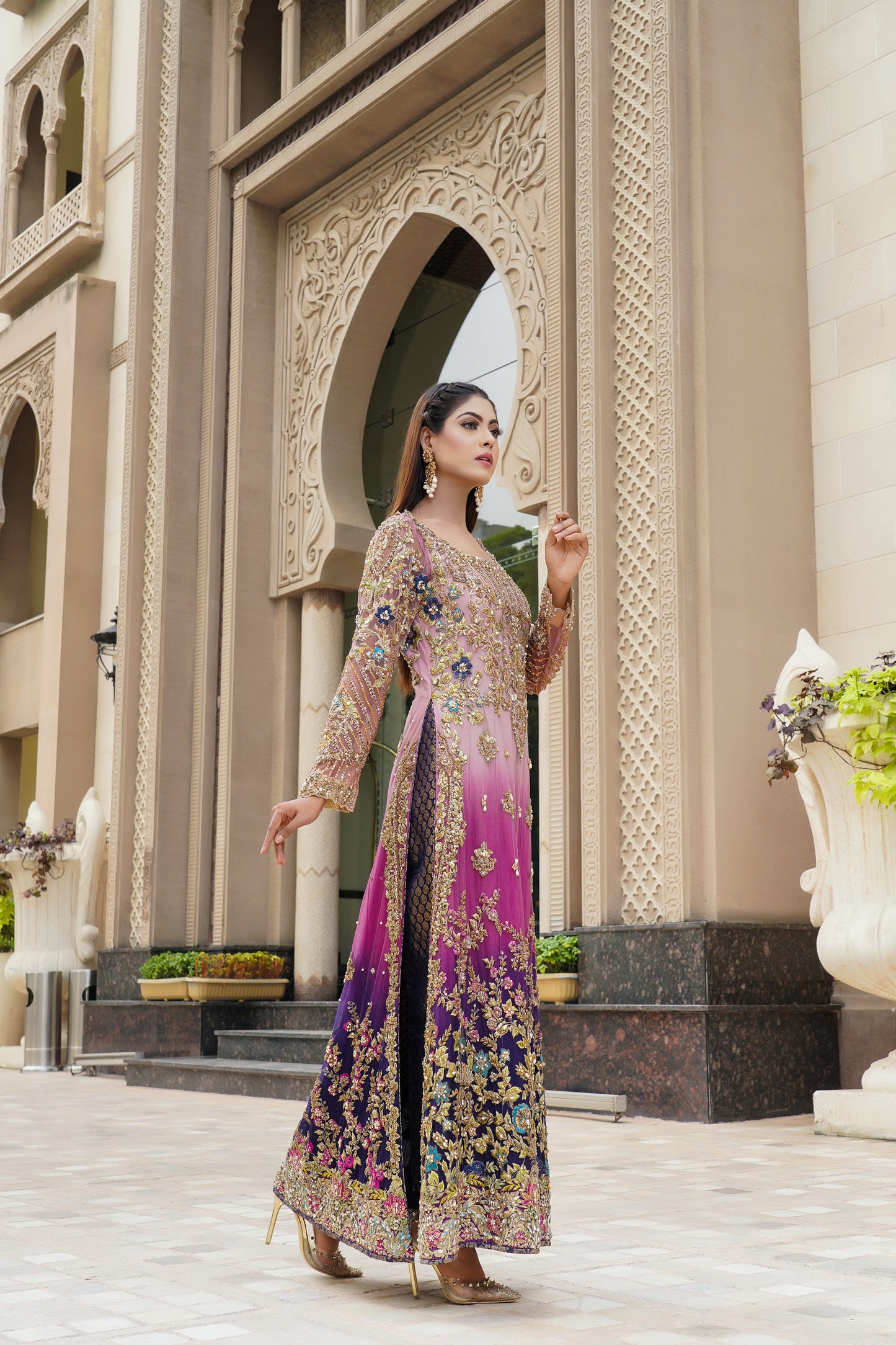 Purple and lacy lilac ombre Pakistani formal dress with dupatta: A stunning dress featuring a blend of purple and lacy lilac colors with intricate embroidery and beadwork on the bodice. The A-line silhouette is made with high-quality, comfortable fabric. The matching dupatta is sheer and lightweight