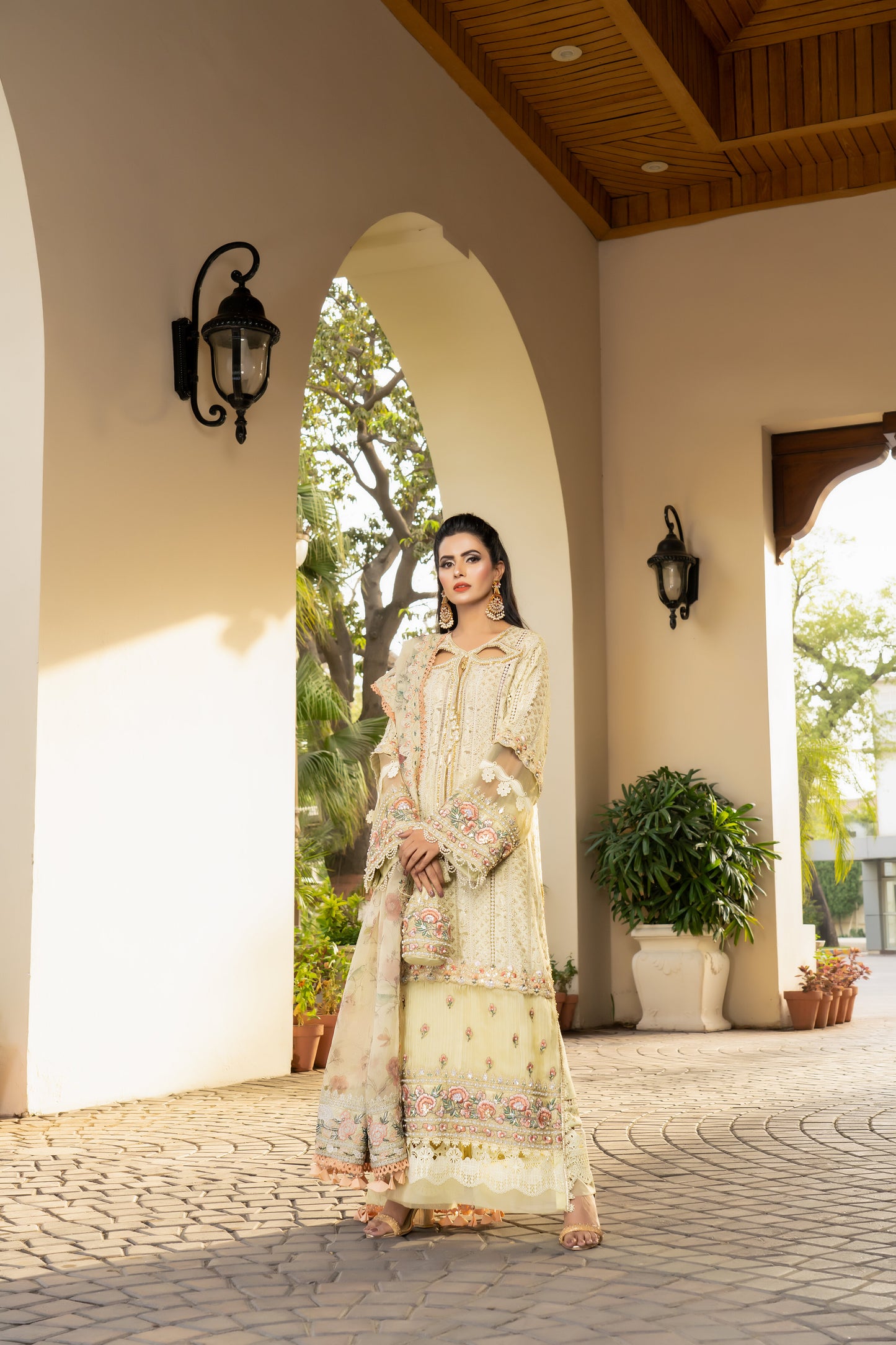 Yellow lime luxury Pret Pakistani dress with fitted bodice, voluminous skirt, and short sleeves. Paired with a printed designed dupatta featuring prints in shades of yellow and lime with a matching border. Perfect for formal events and designed with high-quality fabric and intricate details for both beauty and comfort.