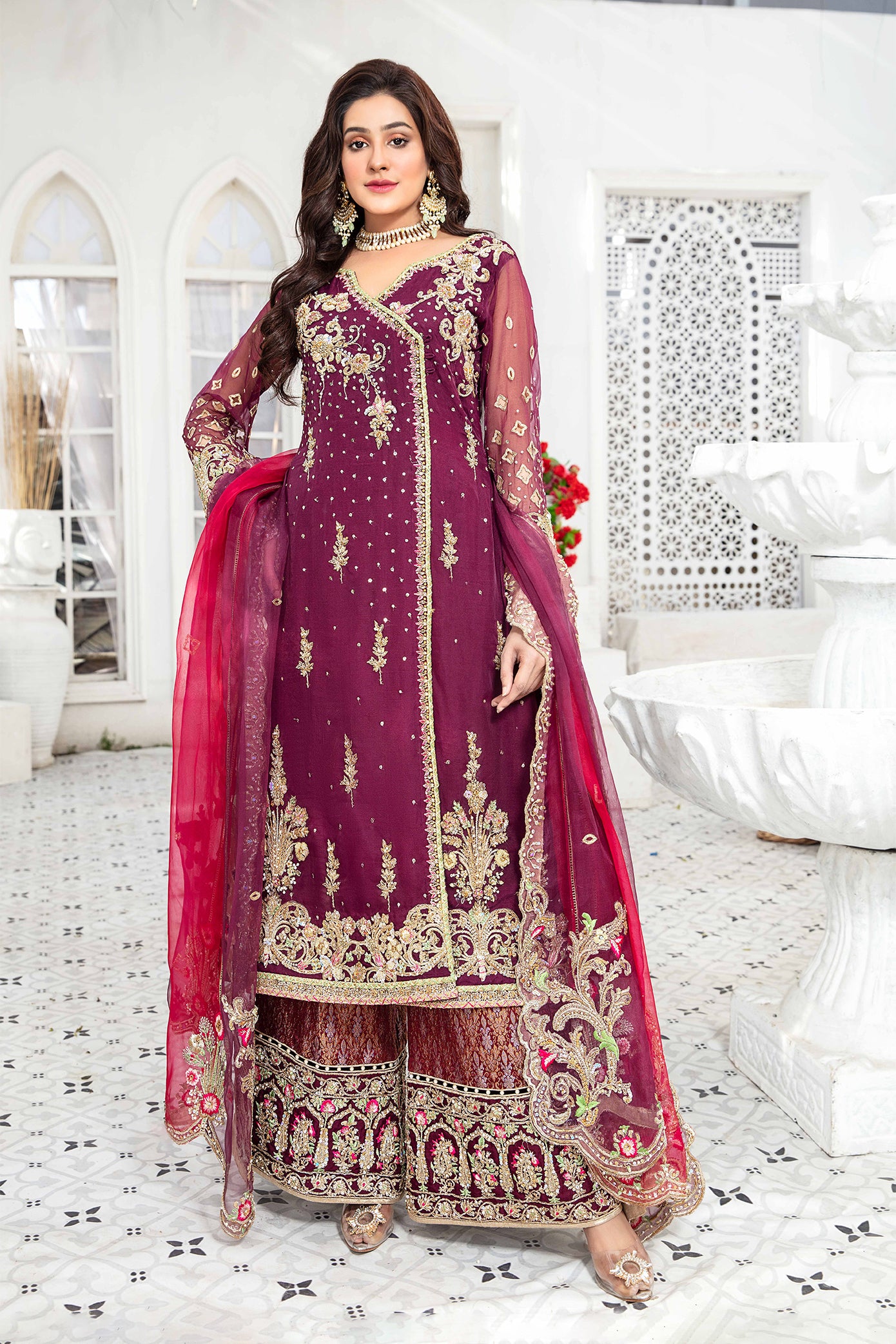 Elegant maroon and gold Pakistani formal dress - This dress features intricate gold embroidery on rich maroon fabric, with a stunning pink dupatta that complements the overall color scheme. A timeless design that is perfect for any formal occasion, this dress exudes elegance and impeccable craftsmanship