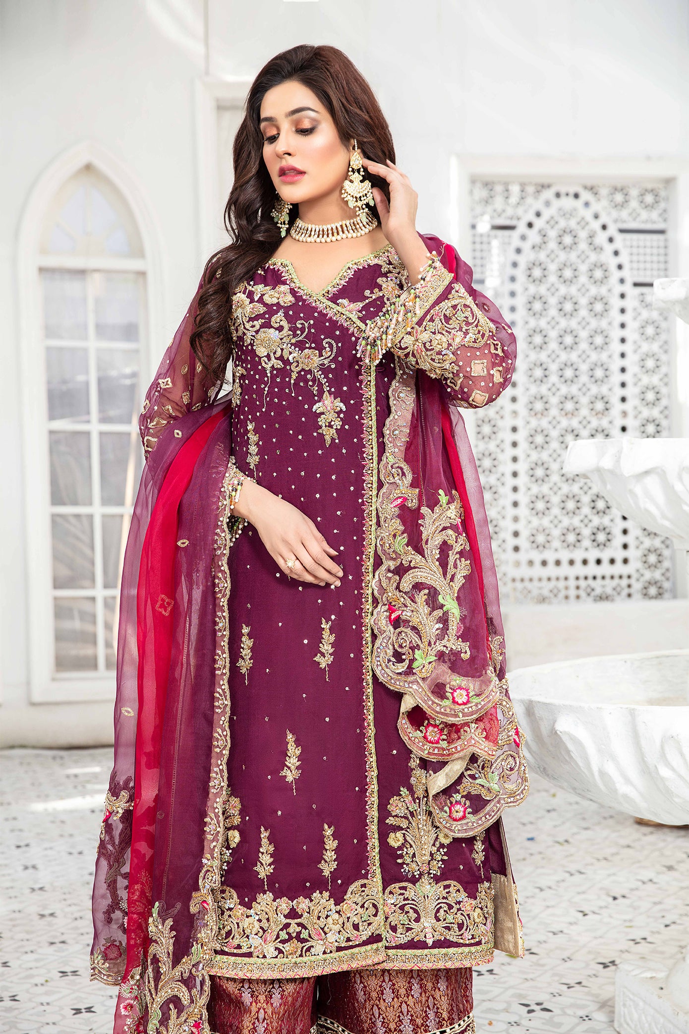 Elegant maroon and gold Pakistani formal dress - This dress features intricate gold embroidery on rich maroon fabric, with a stunning pink dupatta that complements the overall color scheme. A timeless design that is perfect for any formal occasion, this dress exudes elegance and impeccable craftsmanship