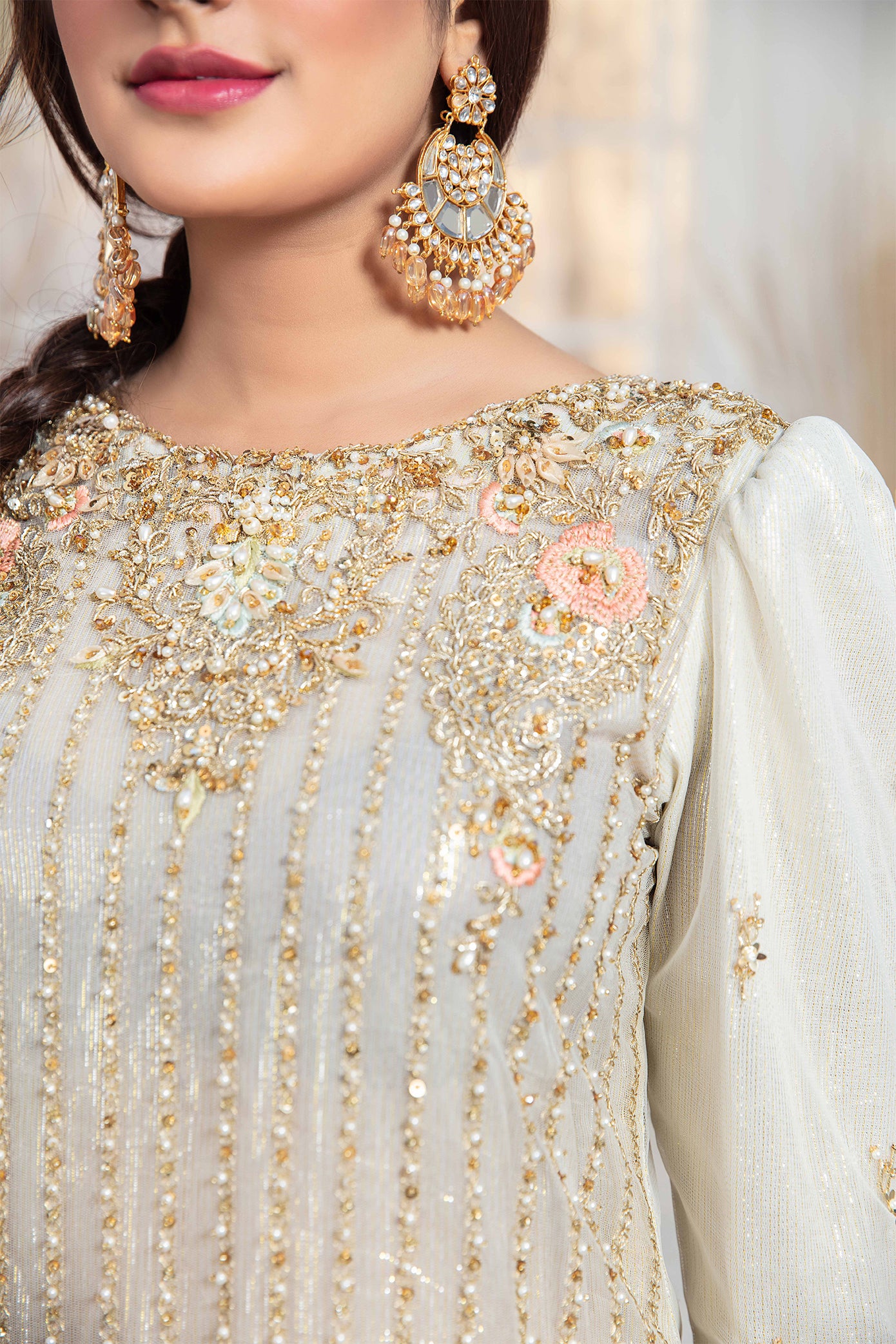 Elegant light gold Pakistani formal dress - Featuring intricate darker gold embroidery work that flows seamlessly down the length of the dress. Completed with a stunning white and rose gold dupatta that adds an extra layer of sophistication to the overall design. Perfect for any formal occasion, this dress is sure to impress with its attention to detail and elegant design