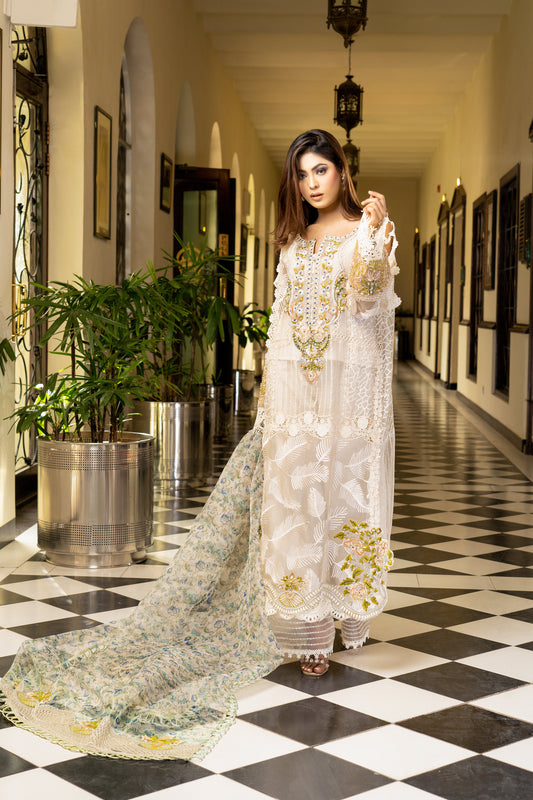 Off-white luxury Pret Pakistani dress with intricate gold work embellishments. Fitted bodice Voluminous skirt with swirling gold work pattern. Paired with a printed designed dupatta featuring floral and paisley prints in gold and off-white, finished with a matching gold trim