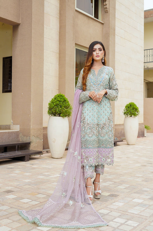 Stunning Pakistani formal dress in turquoise and violet colors, featuring a fitted bodice and flowing skirt, with a complementary pink dupatta. Perfect for formal occasions, this dress is eye-catching and unique with its beautiful color combination.